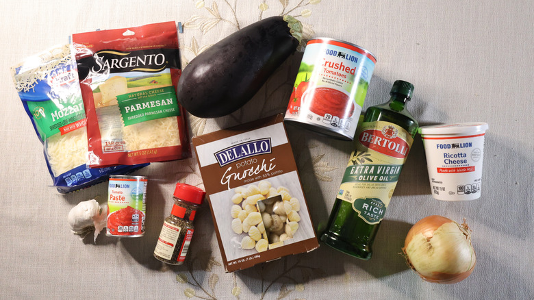 baked gnocchi lasagna ingredients laid out on a table with a white tablecloth