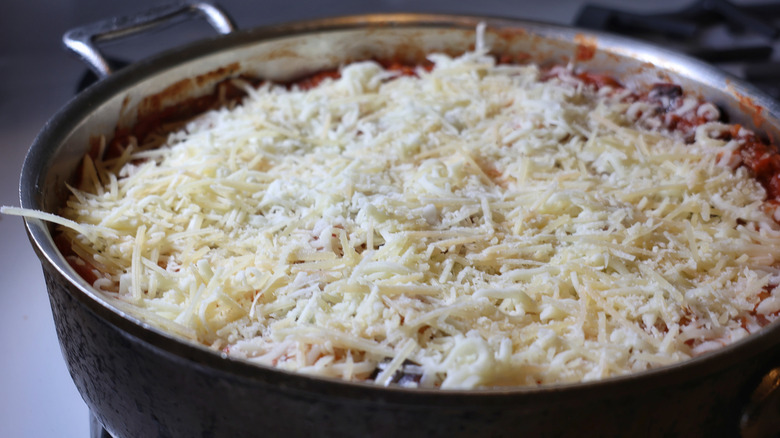pan of gnocchi lasagna topped with shredded cheeses