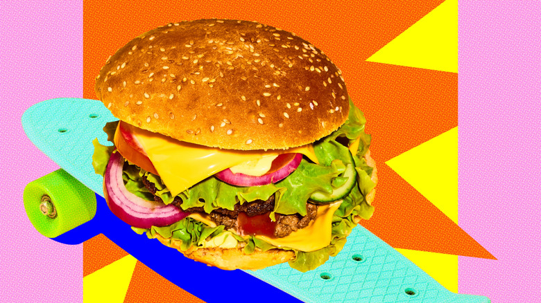 Pop art background with burger on skateboard