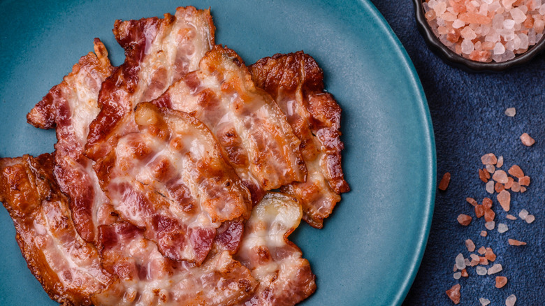 Crispy bacon strips on a plate