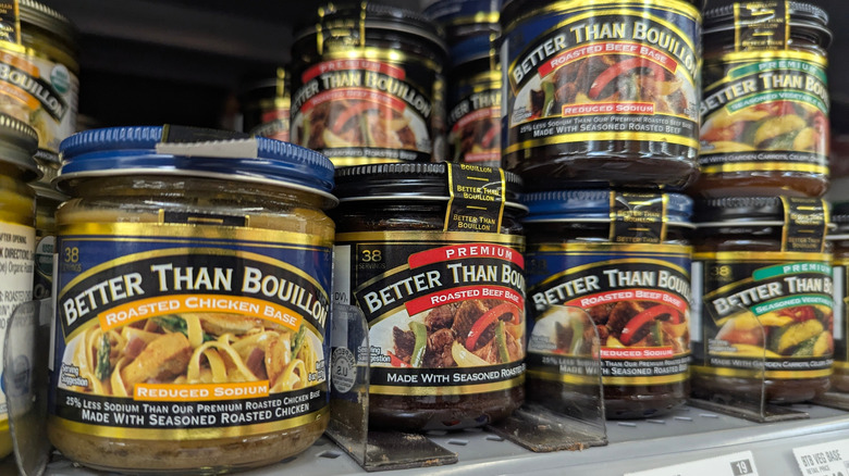 several varieties of Better Than Bouillon concentrate, lined up on a retail store shelf