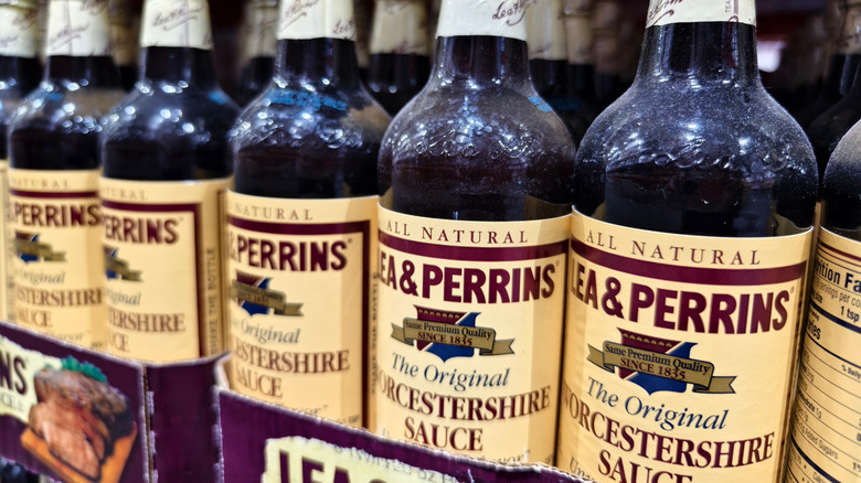 a store display of Lea & Perrins Worcestershire sauce, with dozens of bottles standing upright in cardboard flats