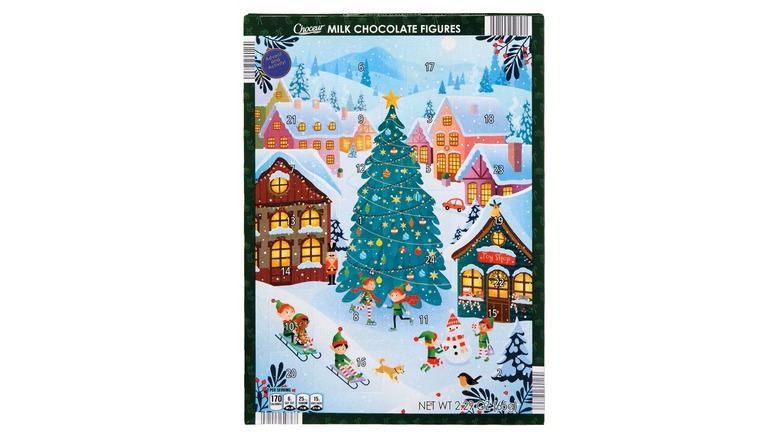 an advent calendar featuring a wintry scene of a Christmas tree in a town