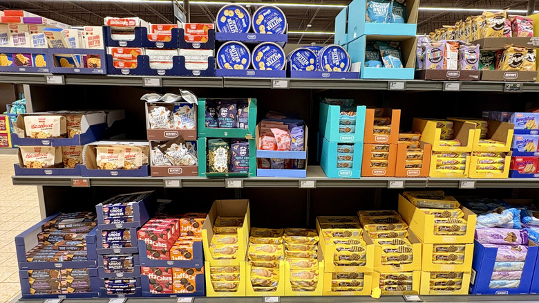 A display of cookies and sweet snacks inside an Aldi store