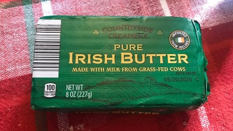 8-ounce package of Irish butter with drawing of fields on foil