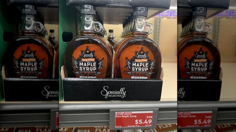 Two rows of maple syrup bottles on Aldi shelf