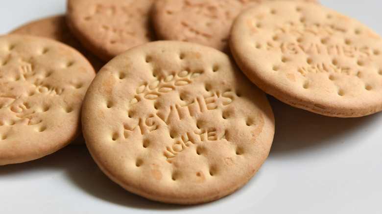 A close-up of digestive biscuits isolated on a white plate