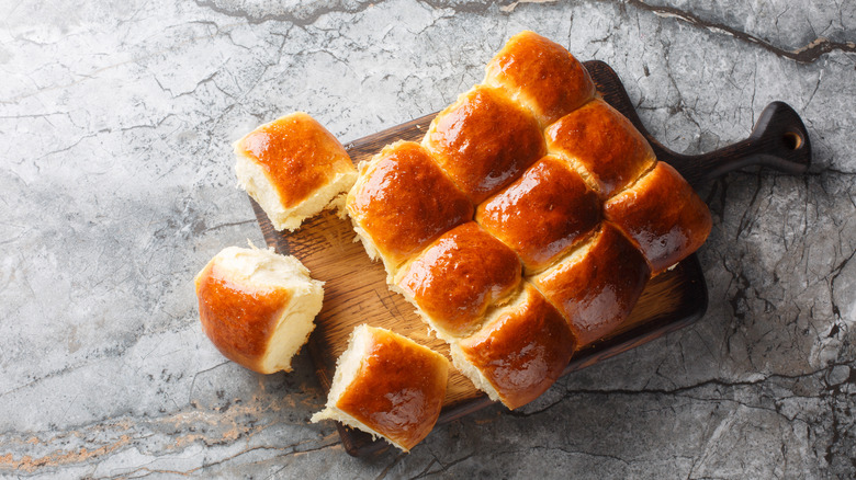 Homemade fresh Hawaiian rolls on wood