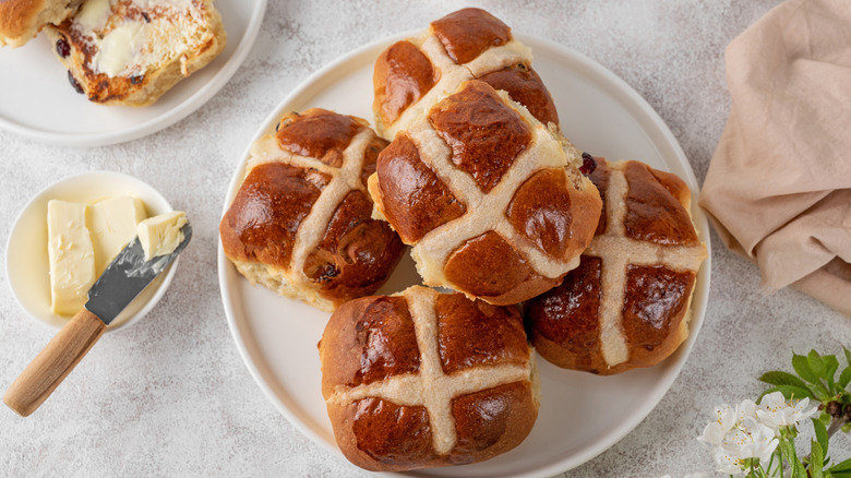 Traditional Easter hot cross buns on a white plate