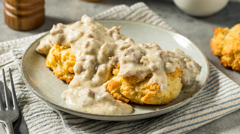 Plate of biscuits topped with creamy sausage gravy