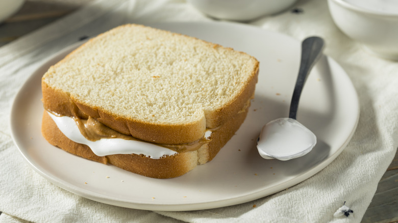 Fluffernutter sandwich on plate with spoon