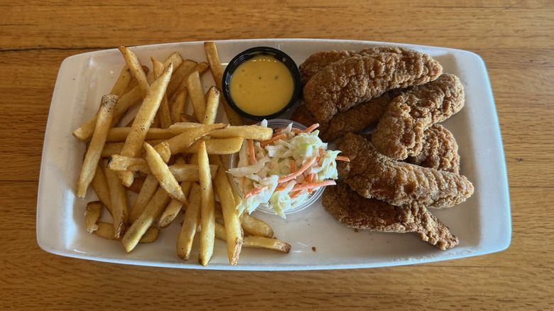 Applebee's chicken tenders plate with fries and coleslaw.