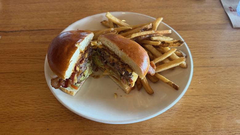 Applebee's Whole Lotta Bacon burger with fries.