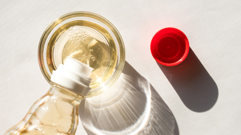 Pouring rice vinegar into bowl