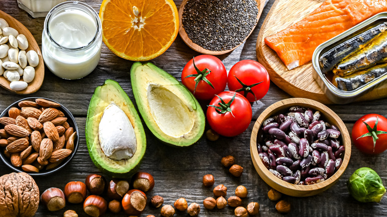 Avocados surrounded by other omega-3 fatty acid foods