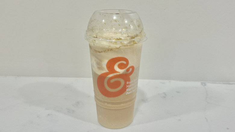 A&W root beer float in to-go cup.