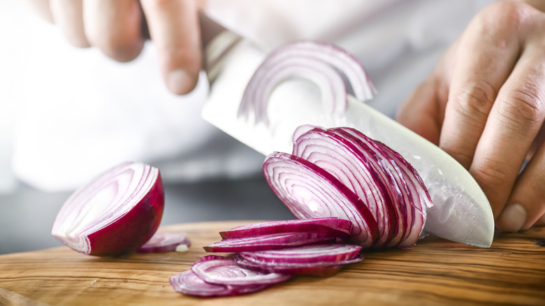 cutting a red onion