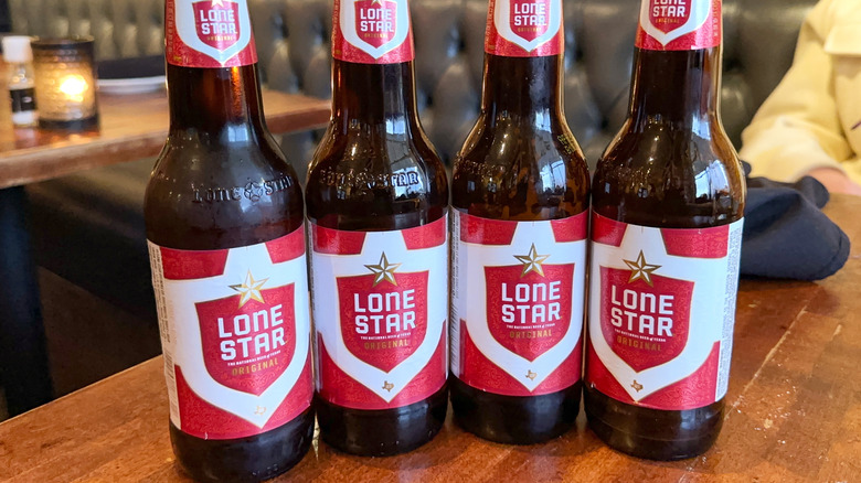 Row of bottles of Lone Star beer on a bar table