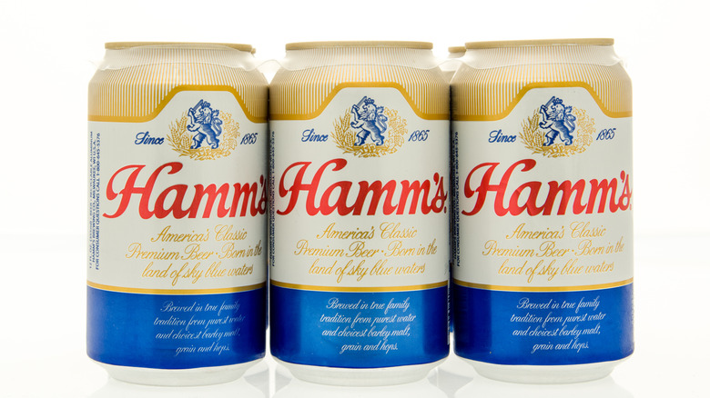 Cans of Hamm's beer on white background
