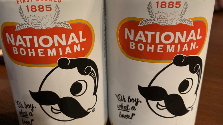 Close up on two cans of National Bohemian