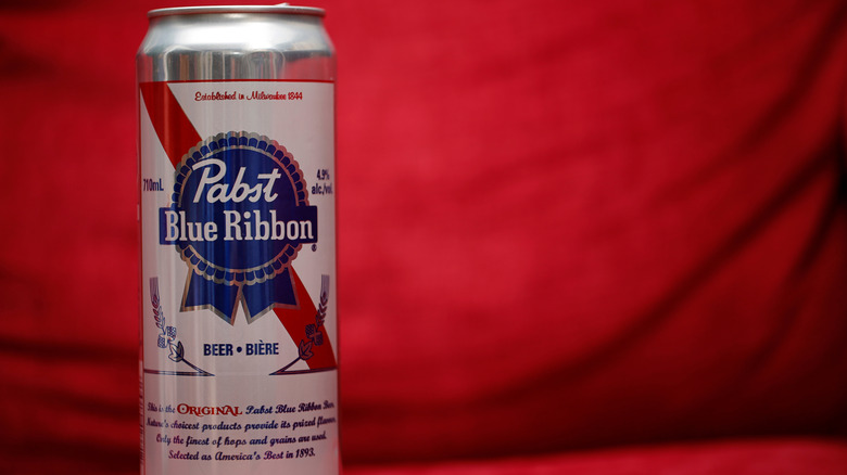 Can of Pabst Blue Ribbon on red background