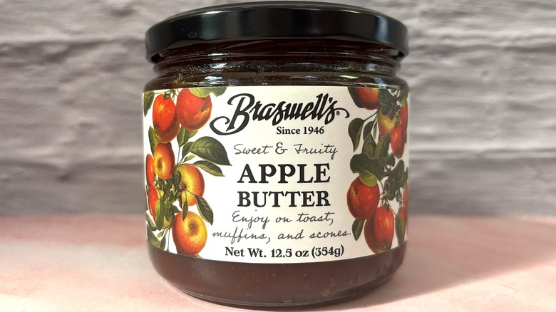 Jar of Braswell's Apple Butter on pink table