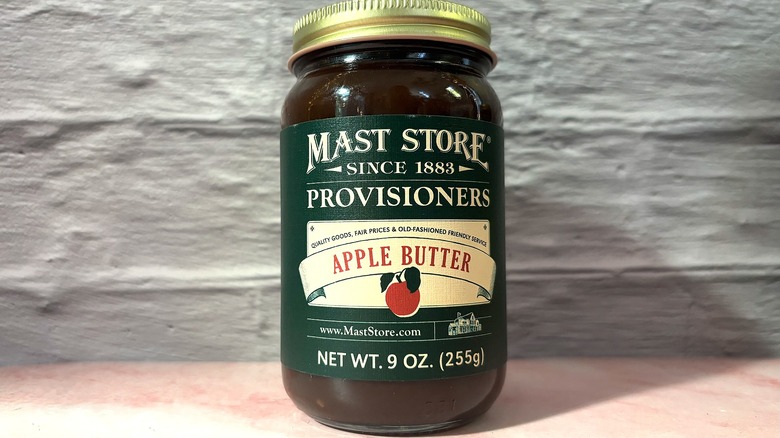 Jar of Mast Store Apple Butter on pink table