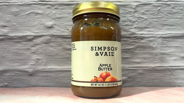 Jar of Simpson & Vail Apple Butter on pink table
