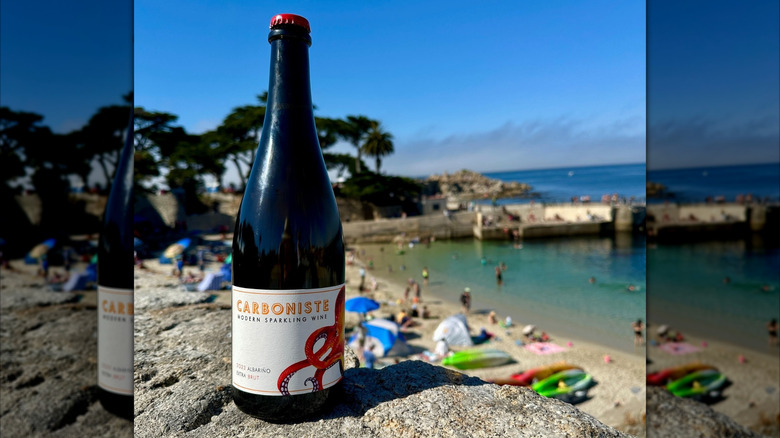sparkling wine bottle at beach