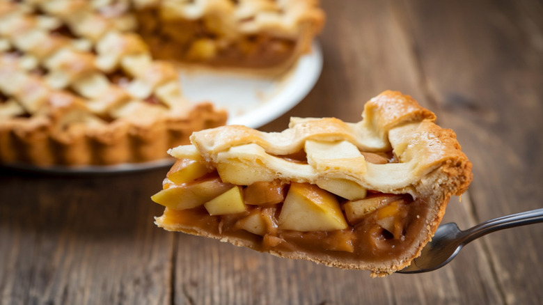 Slice of apple pie on pie knife