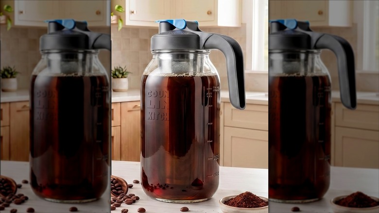 County Line Kitchen cold brew coffee maker with leak-proof lid on countertop with coffee beans and ground coffee