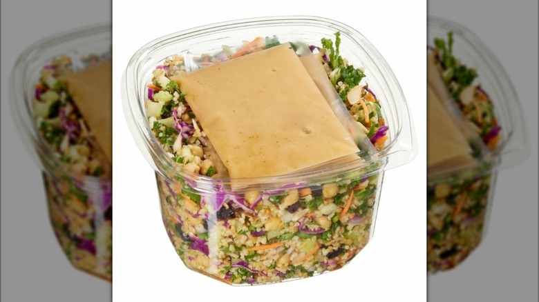 Plastic tub of Kirkland Signature Grain & Celery Salad with Apple Cider Vinaigrette
