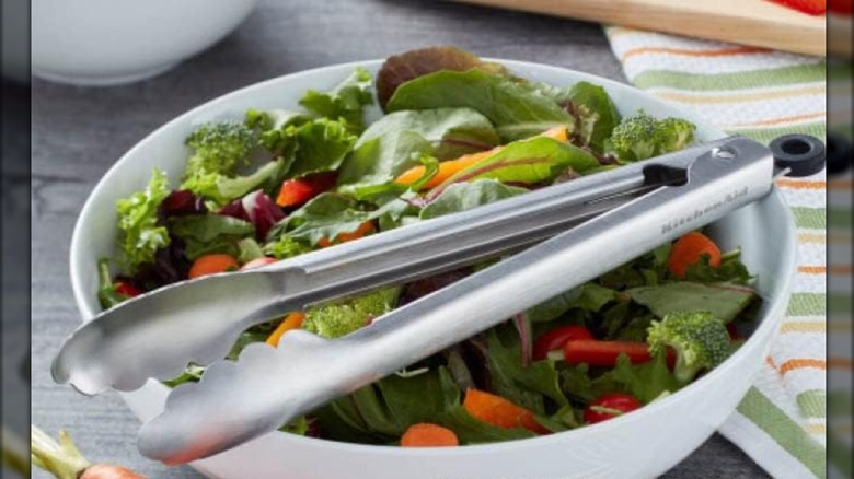 KitchenAid Utility Tongs sitting across a salad bowl