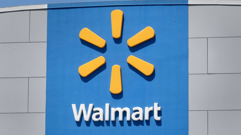 Blue and yellow Walmart sign on grey building