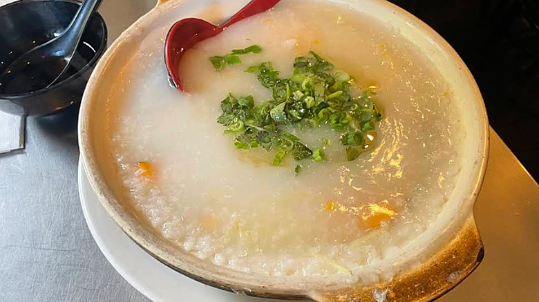 Congee bowl with red spoon at King Noodle