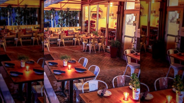 Outdoor patio of Rose's Daughter by candlelight