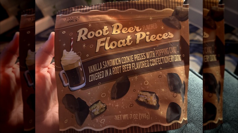 Hand holding brown package of Root Beer Float Pieces