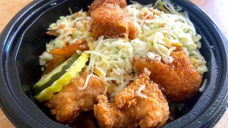 KFC Nashville Hot Loaded Fries Bowl inside black plastic container