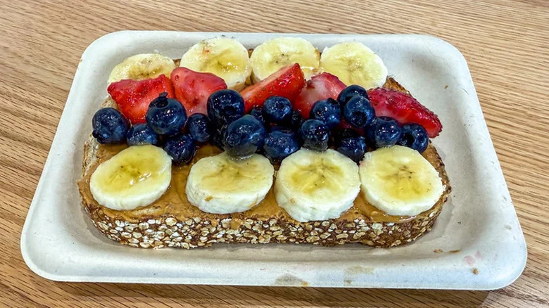 Smoothie King Hearty 8 Grain Loaded Peanut Butter Toast on white tray