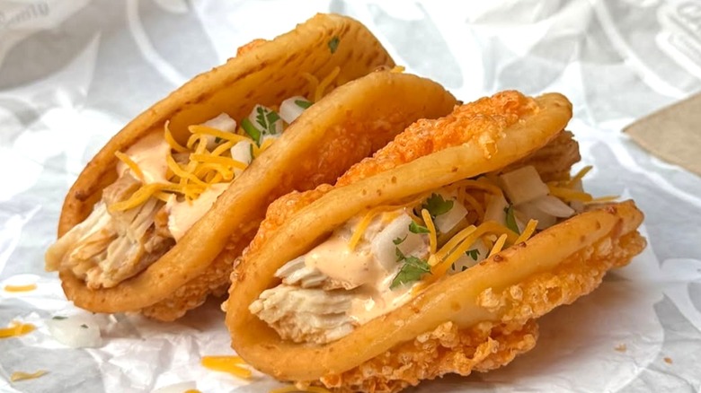 Two Taco Bell Toasted Cheddar Street Chalupas on paper wrapping