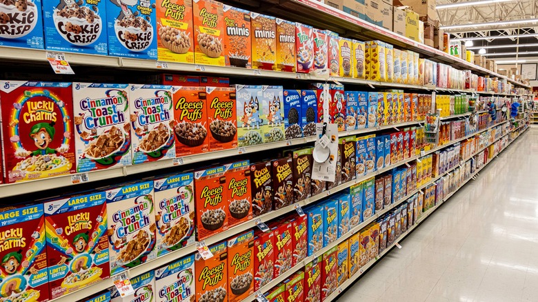 Various breakfast cereals on grocery store shelves