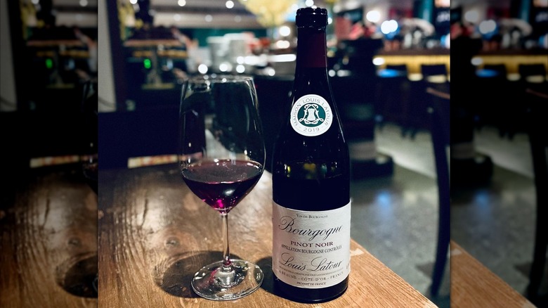 bottle and glass of red wine