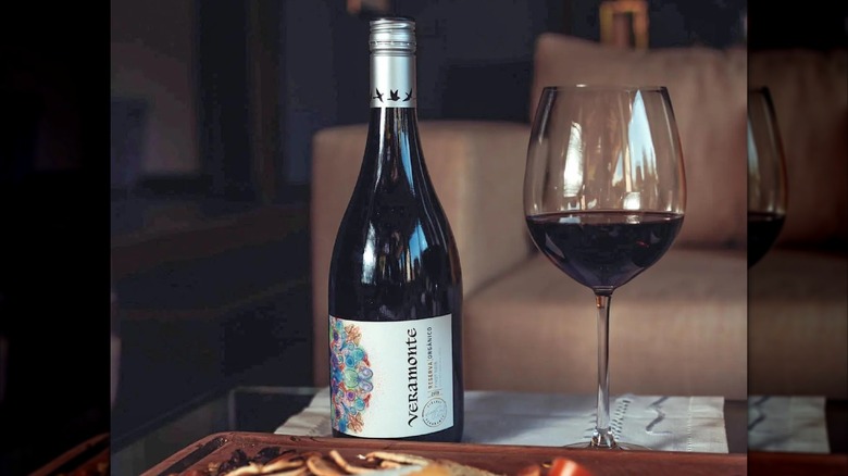 bottle and glass of red wine