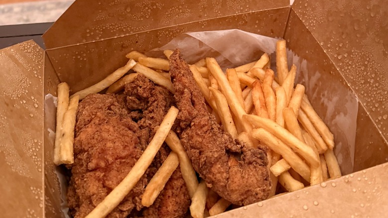to go container of gluten-free chicken tenders and fries