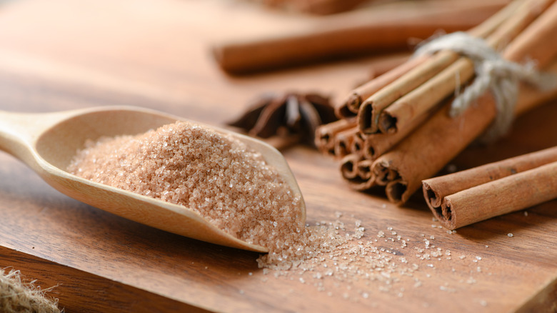 Cinnamon sugar in a wooden scoop