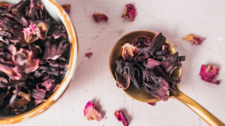 Dried hibiscus flowers on a spoon