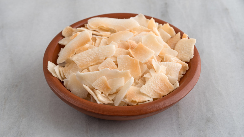 A bowl of toasted coconut