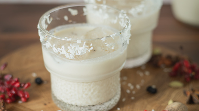 cup of coquito with coconut flakes