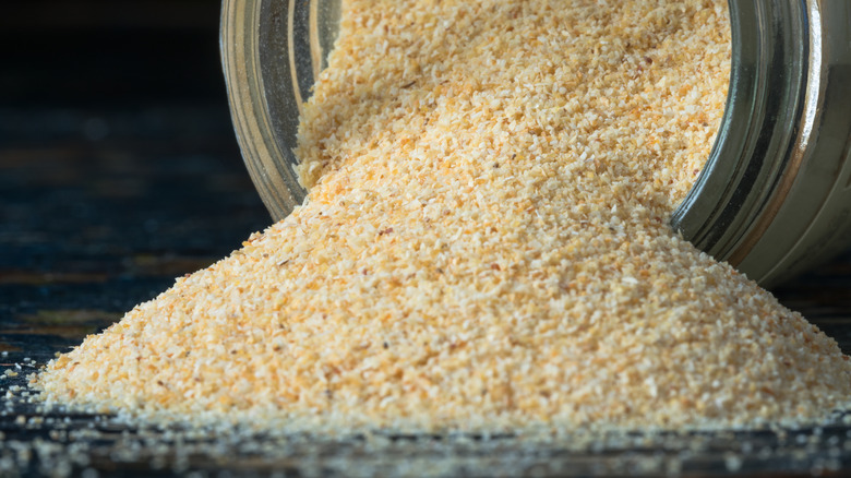 Garlic powder spilling from spice jar