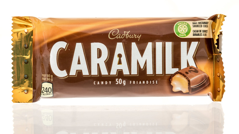A package of Cadbury Caramilk candy bar on an isolated background.